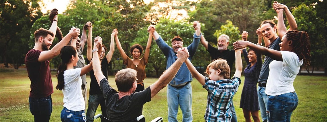 Diverse_community_group_holding_hands_web_1